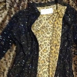 Can be worn as a button up dress or a Jacket.